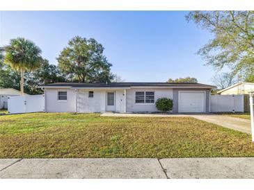 Charming ranch house with a fenced yard and driveway at 14470 Sw 34Th Terrace Rd, Ocala, FL 34473