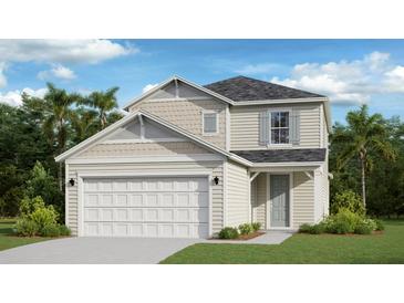 Two-story house with beige siding, gray roof, and a two-car garage at 4021 Ne 31St Ave, Ocala, FL 34479