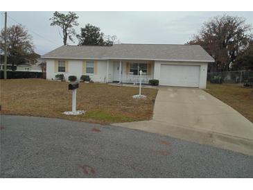 Single-story home with attached garage and carport at 4172 Ne 35Th Avenue Rd, Ocala, FL 34479