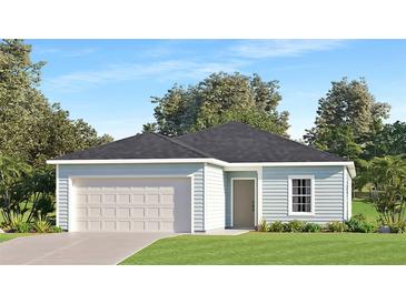 One-story home with light blue siding, attached garage, and landscaping at 6645 Sw 89Th Ln, Ocala, FL 34476