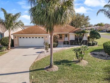 Single-Gathering home with two-car garage and palm trees at 1982 Somerset Ave, The Villages, FL 32162