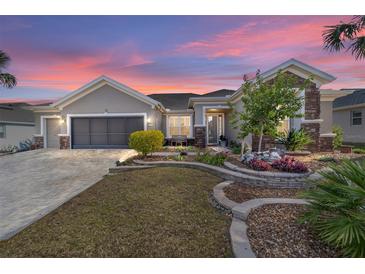 Beautiful one-story home with landscaped yard and two-car garage at 6839 Sw 97Th Terrace Rd, Ocala, FL 34481