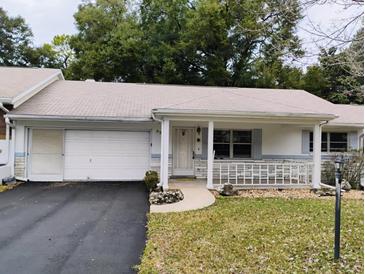 Ranch style home with carport and mature landscaping at 8707 Sw 88Th Court Rd # B, Ocala, FL 34481