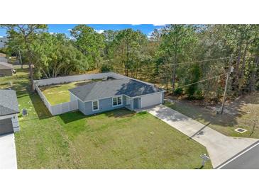 New construction home on a spacious lot with fenced backyard at 307 Marion Oaks Pass, Ocala, FL 34473