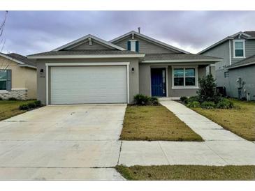 Curb appeal abounds in this charming one-story home featuring a two-car garage and well-manicured lawn at 7208 Sw 61St Sw Pl, Ocala, FL 34474