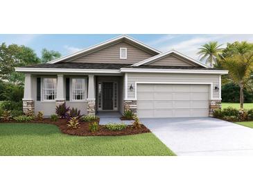 One-story home with stone accents and a two-car garage at 9284 Sw 60Th Court Rd, Ocala, FL 34476