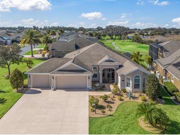 Single-Gathering home with two-car garage and landscaped yard at 3416 Eisenhower Way, The Villages, FL 32163