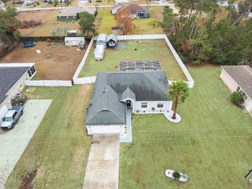 Discover this charming home with a screened-in lanai and a spacious, fenced backyard, perfect for outdoor enjoyment at 4880 Sw 106Th St, Ocala, FL 34476