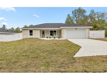 New single-story house with attached garage and fenced yard at 4353 Sw 159Th Ave, Ocala, FL 34481