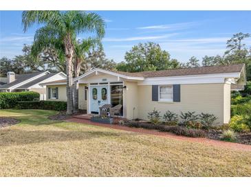 Updated ranch home with inviting front porch and well-manicured lawn at 1244 Se 11Th St, Ocala, FL 34471