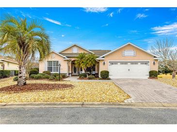 Two-car garage and attractive curb appeal at 8796 Sw 83Rd Cir, Ocala, FL 34481