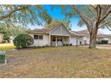 Cute condo with a covered porch and well-manicured lawn at 9662 Sw 95Th Ct # A, Ocala, FL 34481