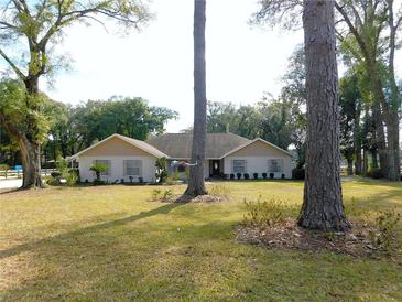 Ranch style home with mature landscaping and large yard at 4960 Se 17Th St, Ocala, FL 34471