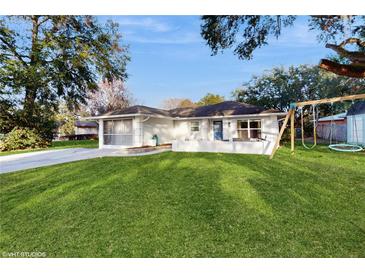 Charming single story home with spacious lawn and swing set at 35428 Crescent Dr, Fruitland Park, FL 34731