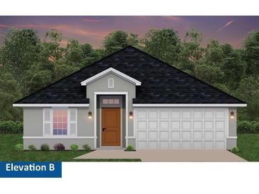 One-story home with a brown door and white garage door at 4421 Sw 90Th Pl, Ocala, FL 34476