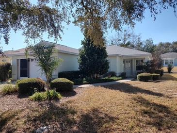 One-story home with attached garage and landscaped yard at 9686 Sw 92Nd Place Rd, Ocala, FL 34481