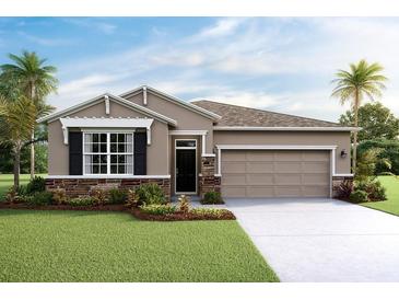 Attractive one-story home with a two-car garage and landscaping at 4074 Nw 48Th Terrace Rd, Ocala, FL 34482