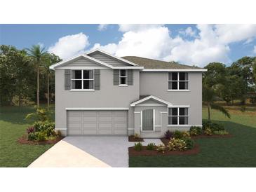 Two story home with gray exterior, two car garage, and landscaping at 4755 Sw 88Th Ln, Ocala, FL 34476