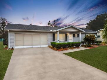 Single-story home with carport and landscaped yard at 8240 Sw 107Th Ln, Ocala, FL 34481