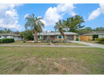 Charming single-story home with landscaped yard and beautiful palm trees at 15052 Sw 43Rd Terrace Rd, Ocala, FL 34473