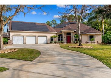 Beautiful single Gathering home with well-manicured lawn, three-car garage, and solar panels at 32 Allenwood Look, Ormond Beach, FL 32174