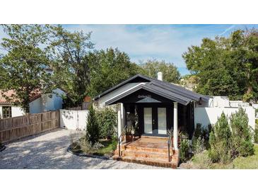 Charming single-story home featuring a welcoming front porch and landscaped front yard at 1655 Sunnyside Dr, Maitland, FL 32751