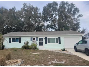 Charming single-story home with a well-maintained yard and a driveway at 8481 Sw 107Th Pl, Ocala, FL 34481