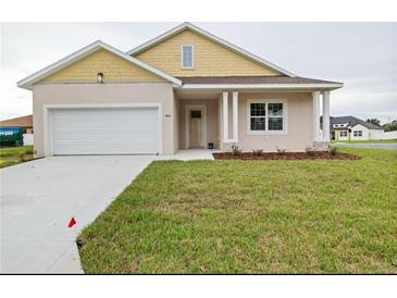 Charming single-Gathering home with a two-car garage, well-manicured lawn, and neutral-toned exterior at 4720 Se 25Th Loop, Ocala, FL 34480