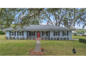 Charming single-story home with mature landscaping and a welcoming front porch at 1225 Se 16Th St, Ocala, FL 34471