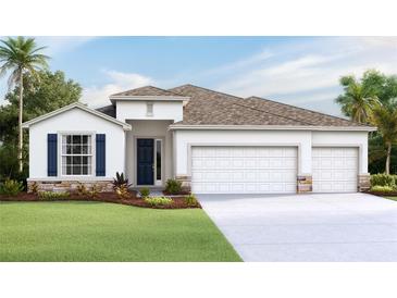 Charming home with a three-car garage, stone accents, and a well-maintained lawn at 3071 Canopy Oak Blvd, Wildwood, FL 34785