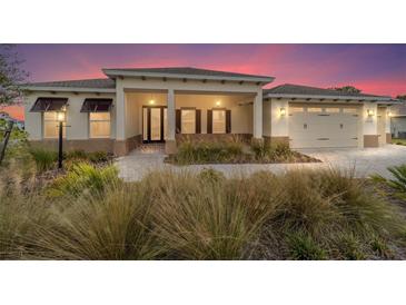 Inviting single-story home with well-manicured landscaping and a cozy front porch at 10314 Sw 96Th Loop, Ocala, FL 34481