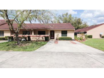 Charming single-story home with a well-maintained lawn and a spacious driveway at 3447 Sw 19Th Pl, Ocala, FL 34474