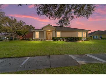 Charming one-story home with a manicured lawn and lovely landscaping at 7092 Sw 93Rd Ave, Ocala, FL 34481