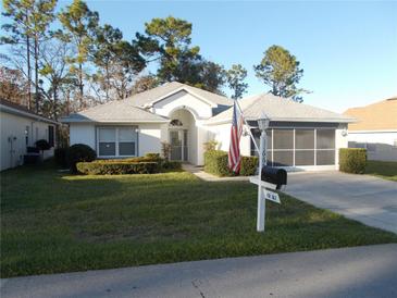 Charming single-story home with well-manicured lawn and inviting curb appeal at 11665 Sw 72Nd Cir, Ocala, FL 34476