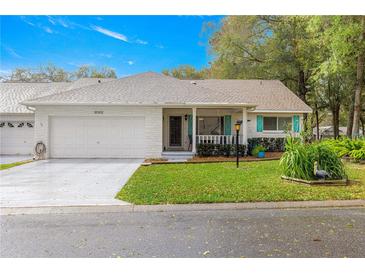 Charming single-story home with a well-manicured front yard and inviting entrance at 8710 Sw 91St Pl # E, Ocala, FL 34481
