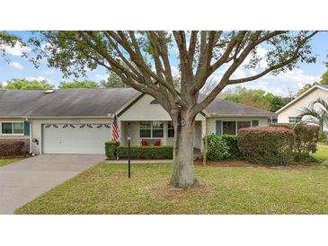 Charming single-story home with a well-manicured lawn and mature landscaping at 9025 Sw 94Th Ln # C, Ocala, FL 34481
