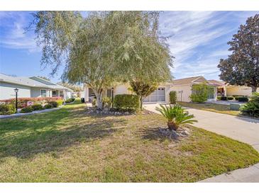 Charming single-story home with a well-maintained lawn, mature trees, and a long driveway at 9575 Sw 92Nd Street Rd, Ocala, FL 34481