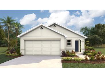 Charming single-story home featuring a two-car garage, well-maintained lawn and a covered entryway at 2171 Ne 28Th Ln, Ocala, FL 34470