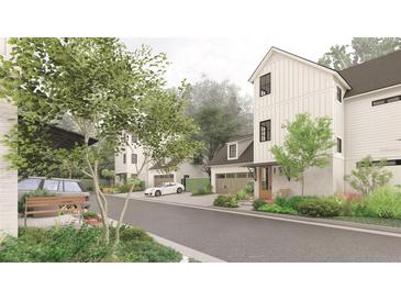 Charming street view showcasing new construction homes with inviting front yards and attached garages at 912 Se 6Th St, Ocala, FL 34471