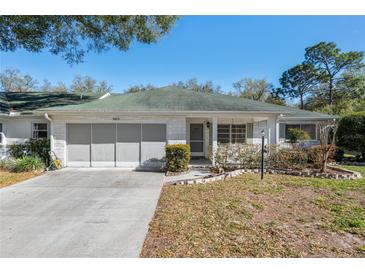 Charming single-story home with a two-car garage, and well-maintained front yard at 9581 Sw 85Th Ave # D, Ocala, FL 34481