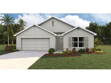 Charming single-Gathering home with a well-manicured lawn and a two-car garage, painted in neutral colors at 16947 Sw 41St Avenue Rd, Ocala, FL 34473
