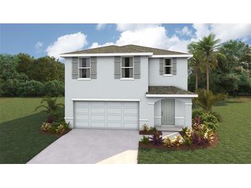 Two-story home featuring a two-car garage, shutters, landscaping, and neutral paint at 8658 Sw 44Th Ter, Ocala, FL 34476