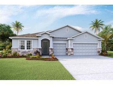 Charming single-Gathering home with a well-manicured lawn, a three-car garage, and stone accents at 3067 Canopy Oak Blvd, Wildwood, FL 34785