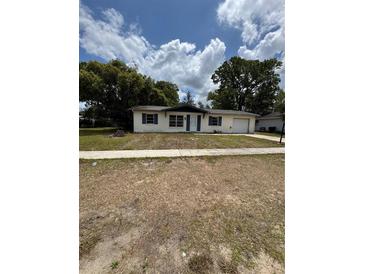 Charming single-story home featuring blue shutters and a well-maintained front yard at 333 Marion Oaks Dr, Ocala, FL 34473