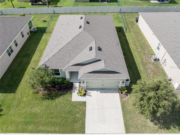 Birds-eye view of the home's roof, landscaping, and proximity to neighboring properties at 6138 Sw 89Th Lane Rd, Ocala, FL 34476