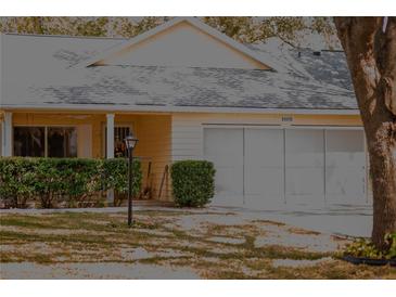 Charming exterior of a single-story home with a well-manicured lawn at 8569 Sw 92Nd Ln # B, Ocala, FL 34481
