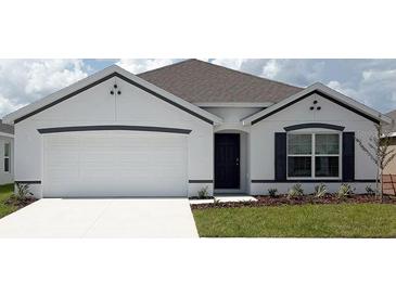 Charming single-Gathering home with a well-manicured lawn, two car garage, and inviting front entrance at 4723 Sw 88Th Ln, Ocala, FL 34476
