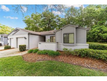 Charming home featuring a well-maintained lawn and beautiful landscaping at 2042 Se 37Th Court Circle Cir, Ocala, FL 34471