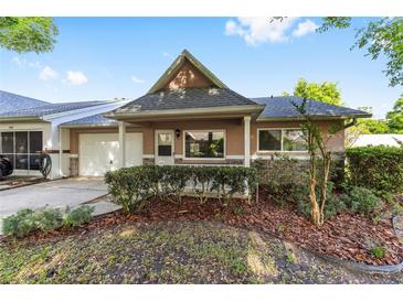 Charming one story townhome with a well maintained lawn, attached garage and pleasant curb appeal at 9320 Sw 89Th Ter # C, Ocala, FL 34481
