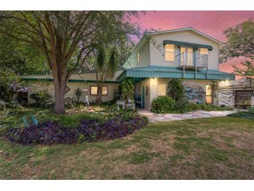 Charming two-story home with landscaped front yard and balcony at 31 Se Chinica Dr, Summerfield, FL 34491